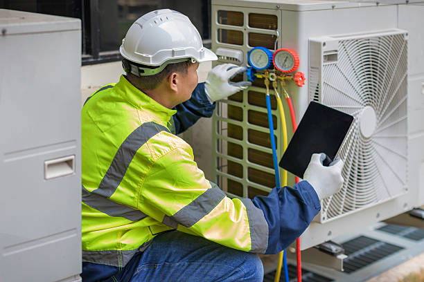 Professional Heat Pump Repair technician working in Bear Creek, AL